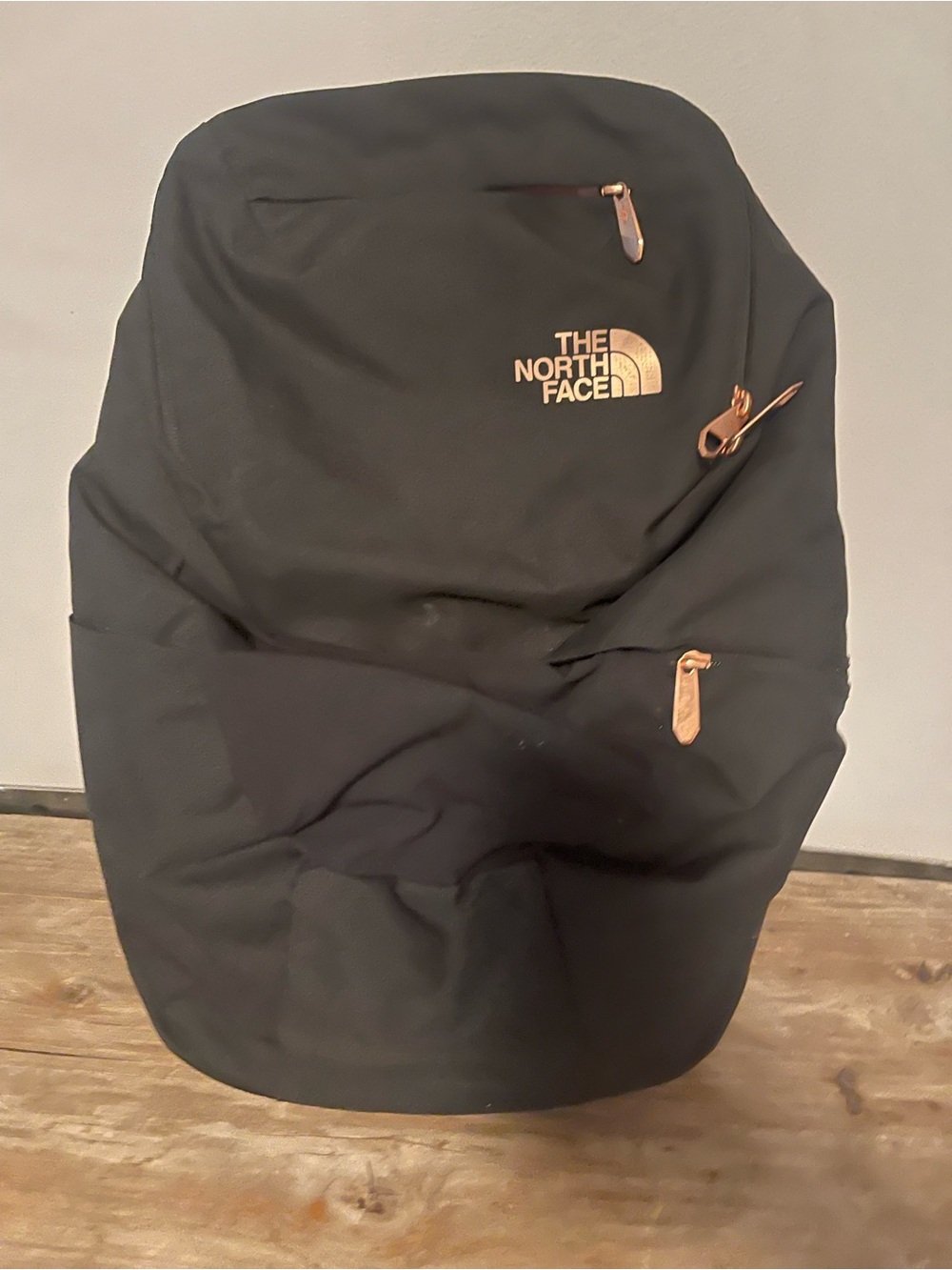 The North Face Black Backpack with Tan Zipper Pulls